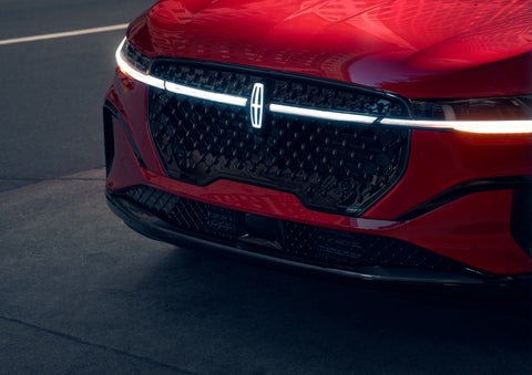 The available front LED light bar and center Lincoln Star logo glow at dusk. | Courtesy Lincoln in Altoona PA