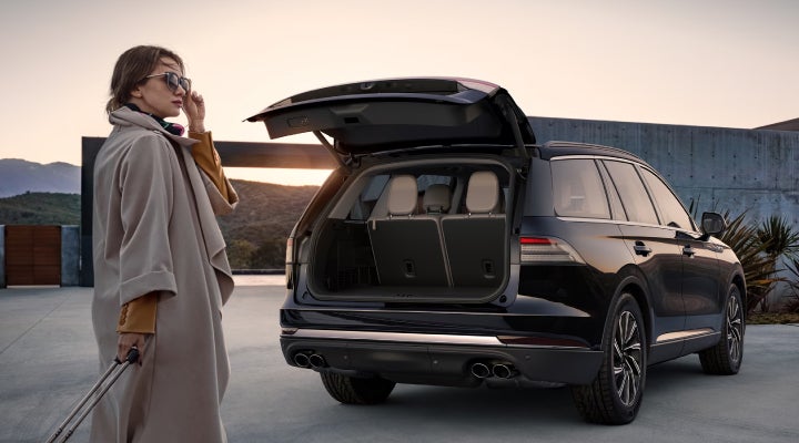 A woman approaches a 2026 Lincoln Aviator® SUV with its rear liftgate open. | Courtesy Lincoln in Altoona PA
