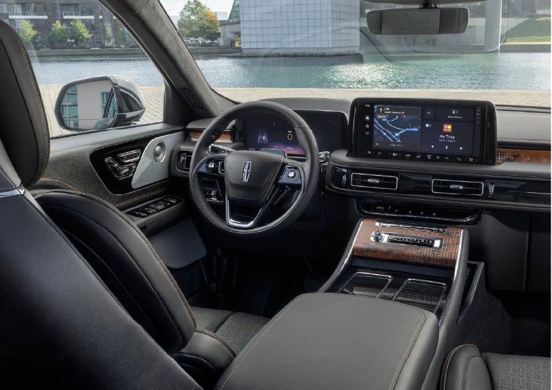 The interior of the 2026 Lincoln Aviator® SUV is shown parked with a view of a harbor through the windshield. | Courtesy Lincoln in Altoona PA
