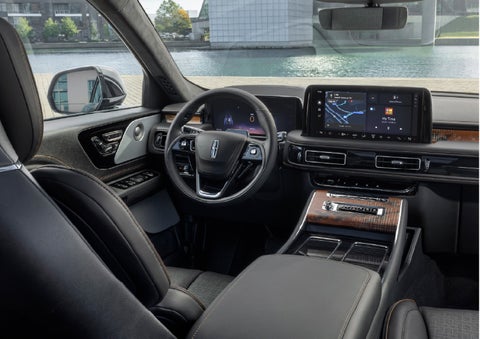The interior of the 2026 Lincoln Aviator® SUV is shown parked with a view of a harbor through the windshield. | Courtesy Lincoln in Altoona PA