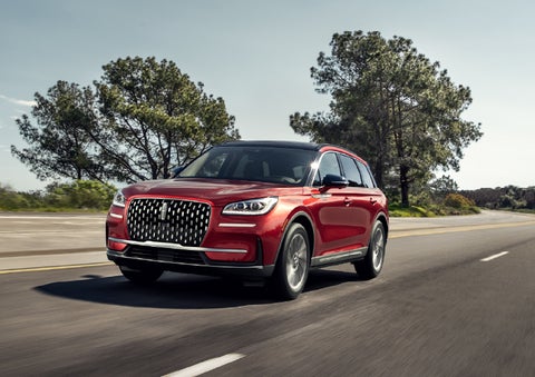 A 2026 Lincoln Corsair® SUV is shown being driven on a country road. | Courtesy Lincoln in Altoona PA
