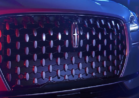 The grille of a 2025 Lincoln Corsair&reg; SUV reflects neon light at night. | Courtesy Lincoln in Altoona PA