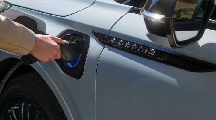 A hand is plugging in a 2026 Lincoln Corsair® Grand Touring Plug-in Hybrid SUV. | Courtesy Lincoln in Altoona PA