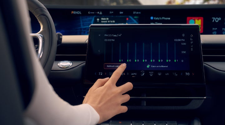 A woman is shown using the Auto Air Refresh feature in the 2026 Lincoln Nautilus® SUV. | Courtesy Lincoln in Altoona PA
