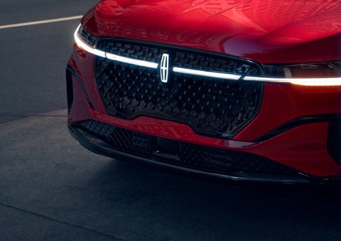 The available front LED light bar and center Lincoln Star logo glow at dusk. | Courtesy Lincoln in Altoona PA