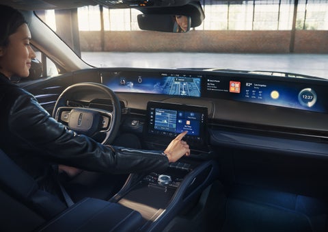 The driver of a 2026 Lincoln Nautilus® SUV interacts with the center touchscreen. | Courtesy Lincoln in Altoona PA