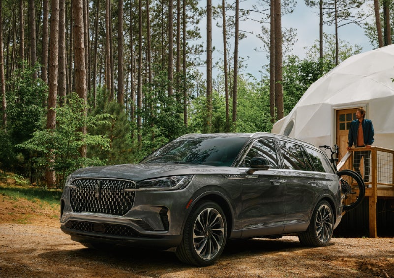 A 2027 Lincoln Aviator® is parked next to a high end glamping site. | Courtesy Lincoln in Altoona PA