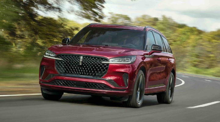 A 2027 Lincoln Aviator® SUV is being driven on a country road | Courtesy Lincoln in Altoona PA